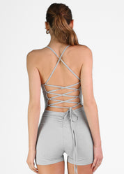 REMI - tuta jumpsuit corta con arricciatura e lacci posteriori.