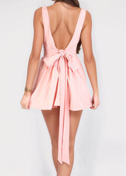 GABRIELLE - vestito mini rosa con gonna ampia con scollo posteriore e fiocco