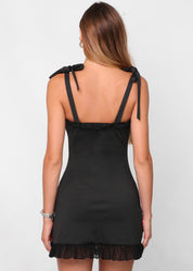 SAIDE - vestito mini nero con fiocchi alle spalle e dettagli in tessuto mesh