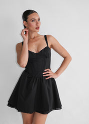 PETAL - vestito nero corto e fasce laterali per dettaglio fiocco posteriore