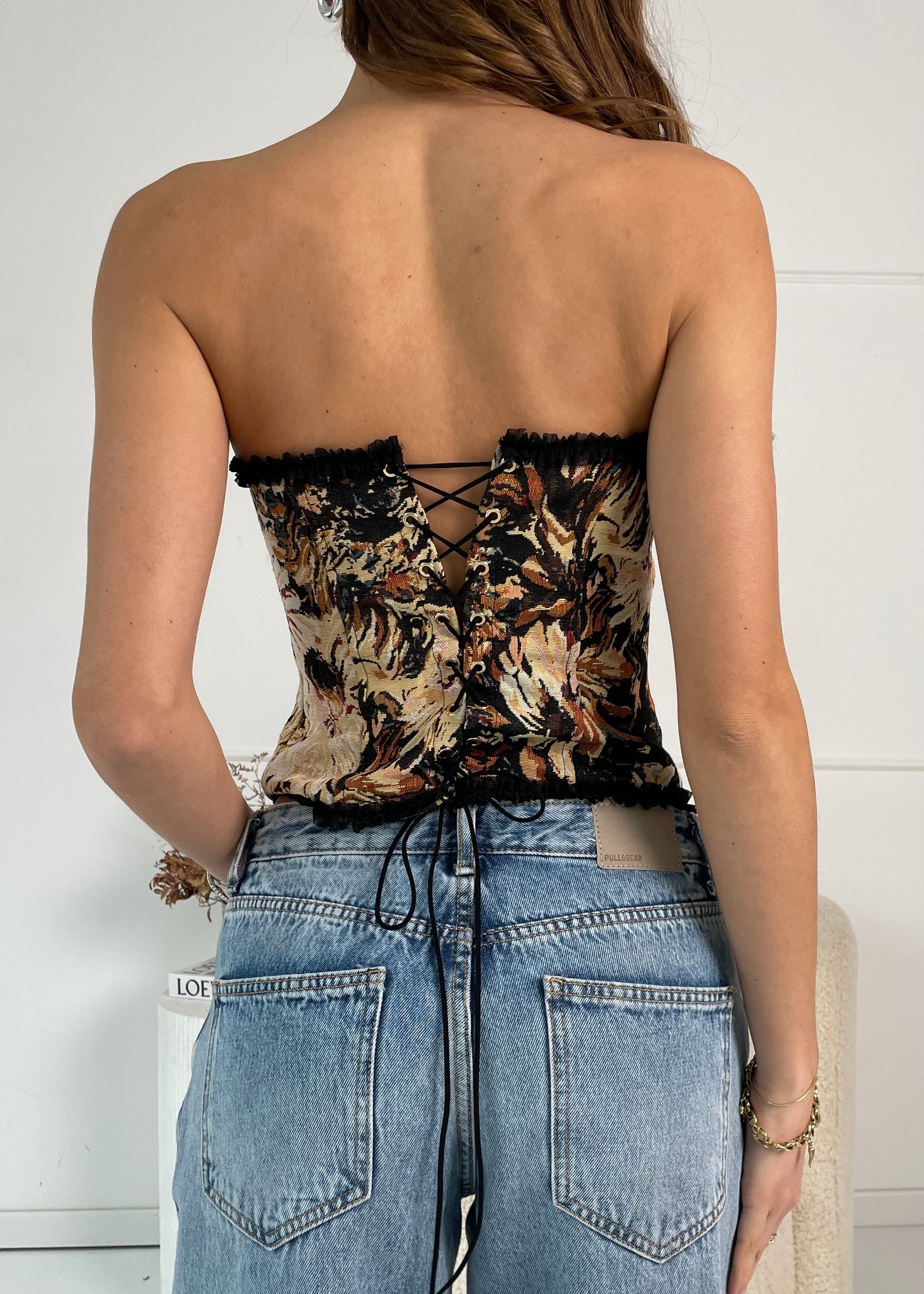 FLORIA - top corpetto nero con orlo ruches e fiocco e allacciatura posteriore