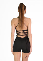 REMI - tuta jumpsuit corta con arricciatura e lacci posteriori.