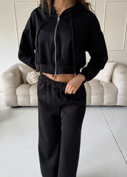 TAMIE - tuta nera con felpa, top corpetto e pantalone a zampa