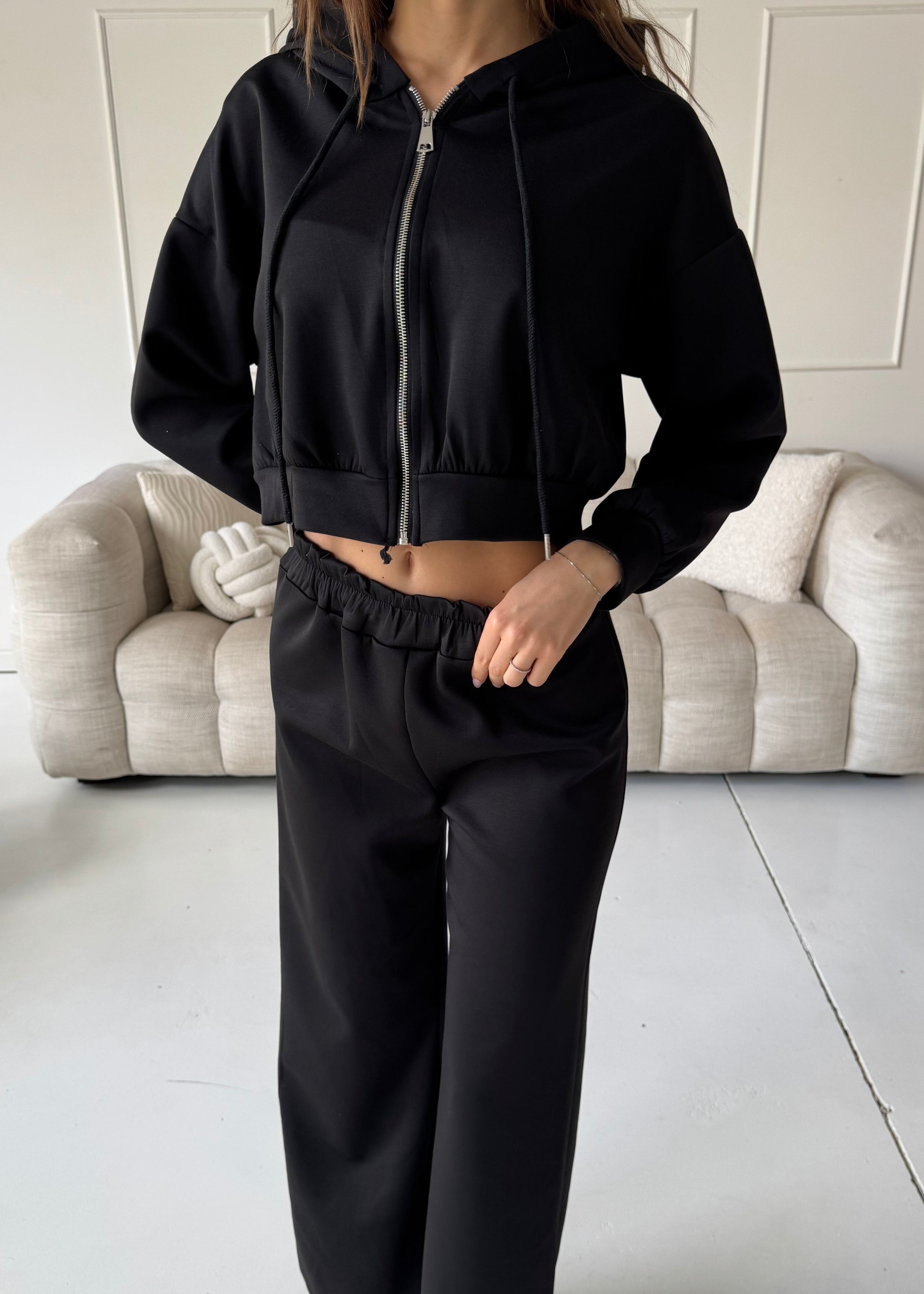 TAMIE - tuta nera con felpa, top corpetto e pantalone a zampa