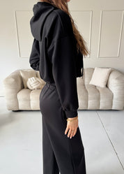 TAMIE - tuta nera con felpa, top corpetto e pantalone a zampa