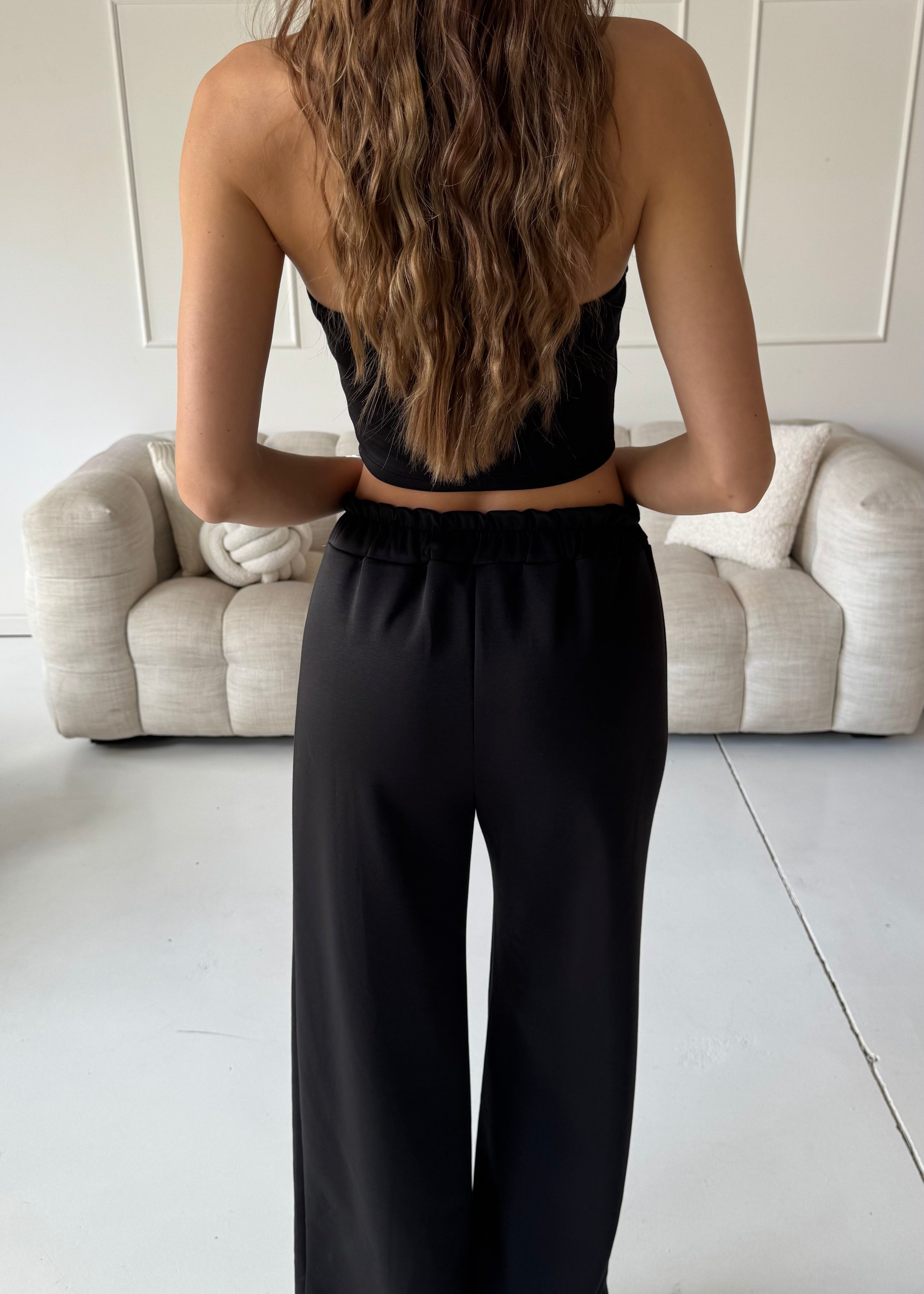 TAMIE - tuta nera con felpa, top corpetto e pantalone a zampa