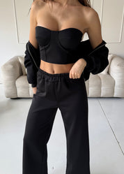 TAMIE - tuta nera con felpa, top corpetto e pantalone a zampa