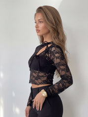 TELTI - maglia in pizzo nero con cut-out con fiocchi