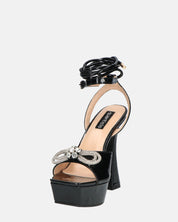 JANINE - tacchi alti con platform in glassy nero e fiocco con gemme